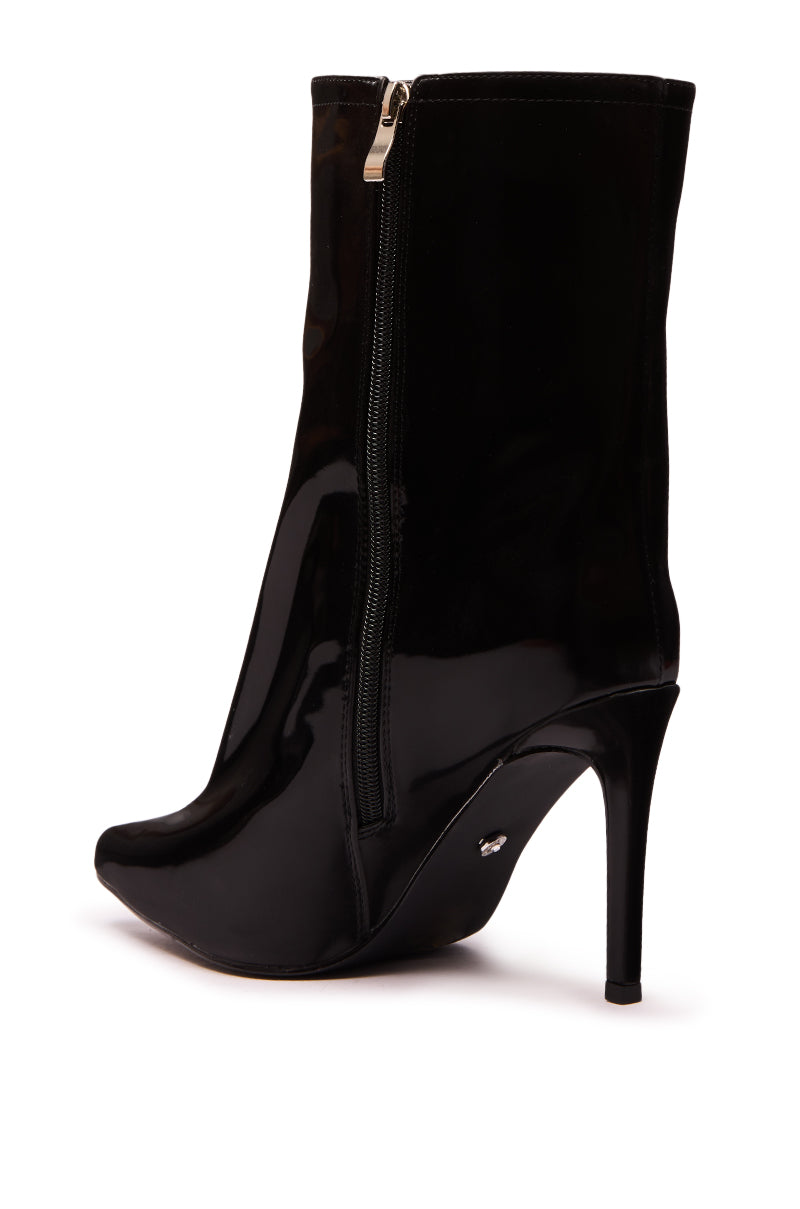 The AZALEA WANG QUINNTA BLACK BOOTIE is a shiny faux patent leather bootie with a stiletto heel, pointed toe, side zipper, and sleek silhouette.