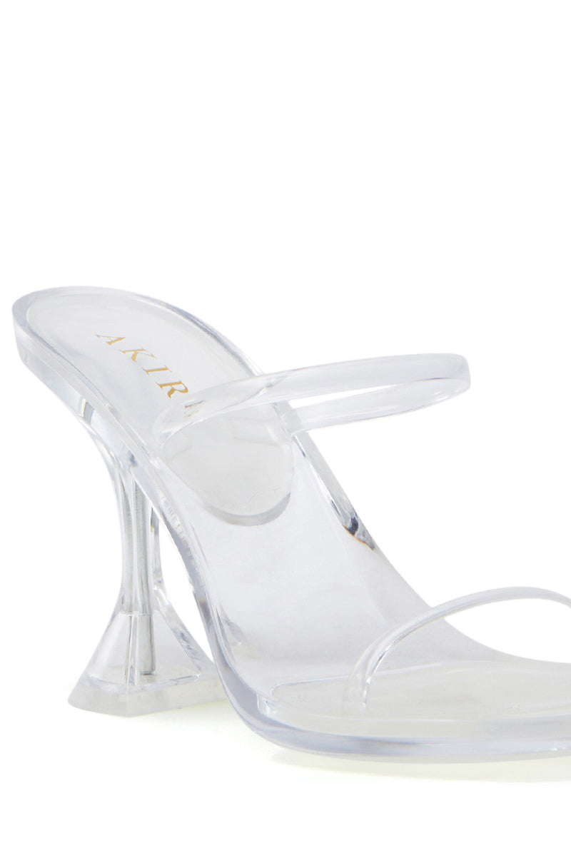 The AKIRA QUIRON CLEAR SANDAL features an open square toe, two transparent straps, and a flared stiletto heel.
