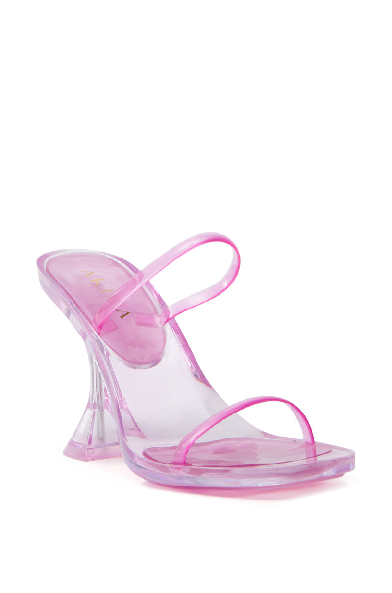 The AKIRA QUIRON PINK SANDAL is a trendy single high-heeled sandal with a transparent pink design, featuring a clear flared heel, two thin straps across the foot, PVC upper, and see-through sole for a sleek modern look.