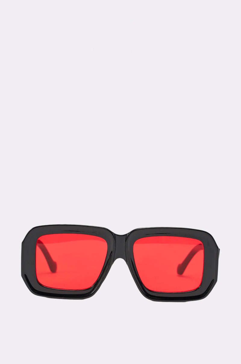 RED VISION SUNGLASSES feature an oversized rectangular black frame with bold, thick edges and vibrant red-tinted lenses, shown against a plain white background. 2