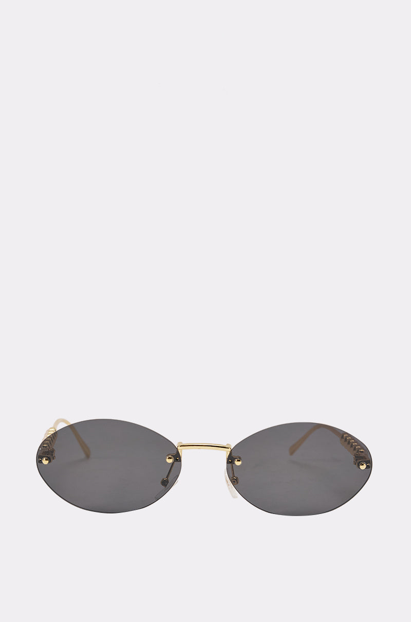 SEE YA SUNGLASSES: Vintage mini oval sunglasses with a rimless design, dark lenses, and slim gold bridge and arms, shown on a plain white background. 2