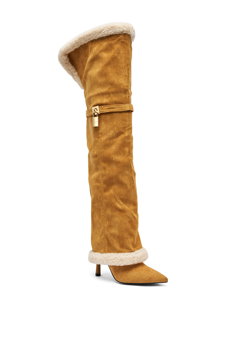 The AZALEA WANG RACHANA Tan Sherpa Stiletto Boot features a pointed toe, short heel, white sherpa trim, decorative gold buckle strap, and a slouchy oversized knee-high faux suede shaft.
