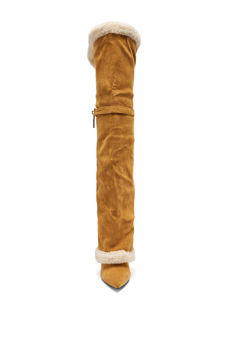 The AZALEA WANG RACHANA Tan Sherpa Stiletto Boot features tan faux suede, a pointed toe, shearling trim at the top and bottom, and a tie detail around the upper calf, displayed facing forward against a white background.