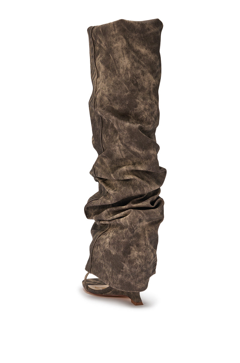 The AZALEA WANG Brown Acid Washed Denim Gladiator Sandal features a statement silhouette in acid washed denim, with textured detailing and a tall, slouchy fit, showcased against a white background. 5