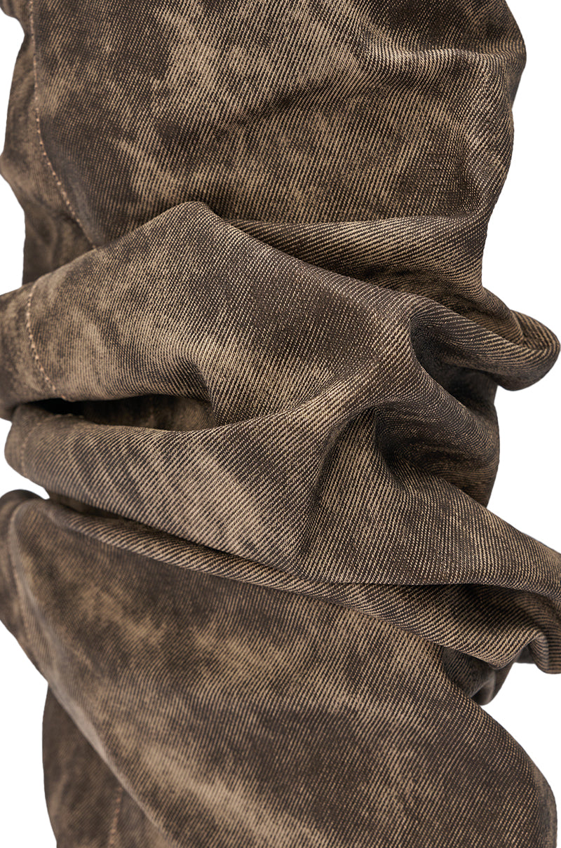 Close-up of the AZALEA WANG BROWN ACID WASHED DENIM GLADIATOR SANDAL, showcasing its brown, distressed denim with textured folds and creases, set against a white background. 6