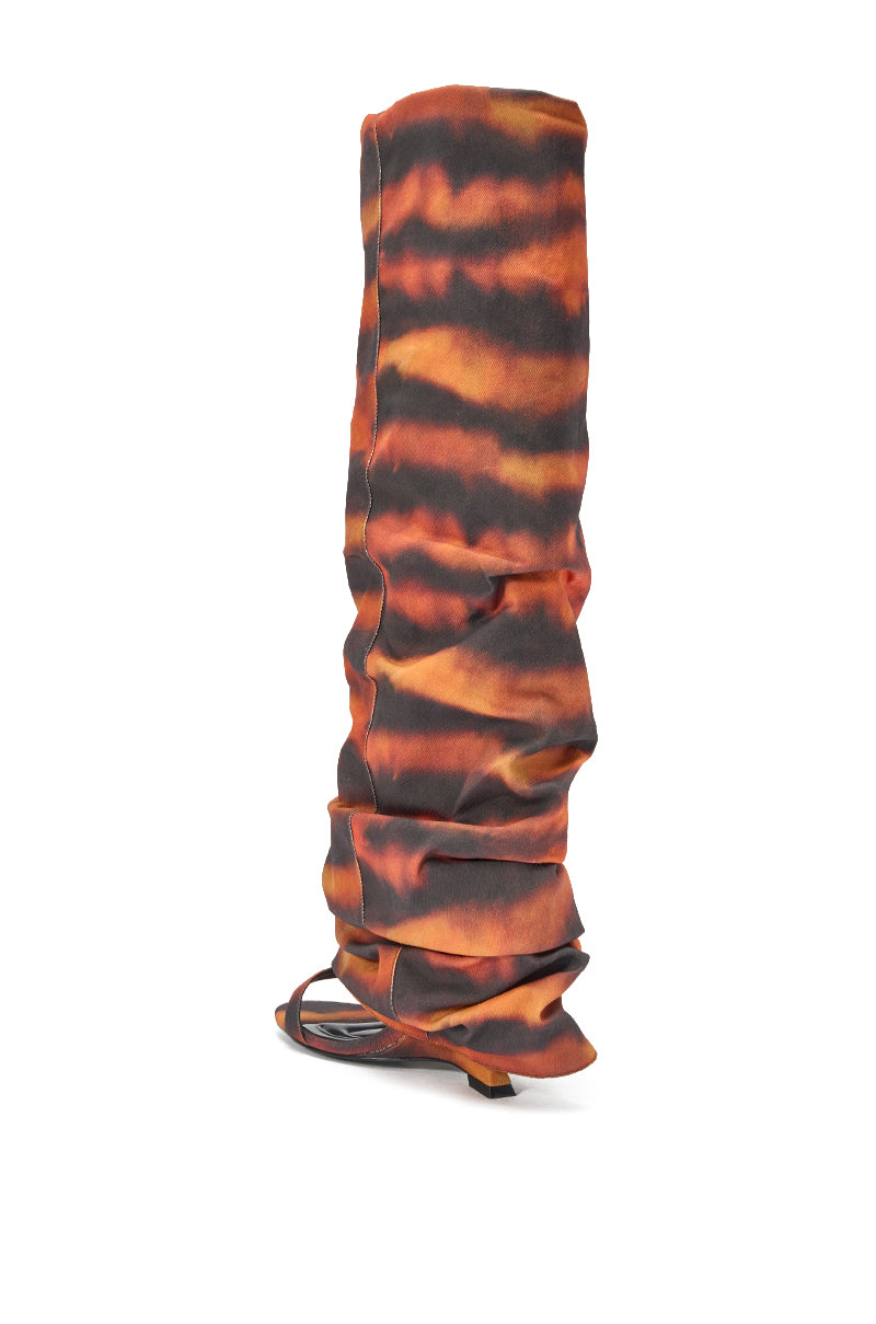 The AZALEA WANG RADLEY Tiger Print Slouchy Wedge Boot is a tall, knee-high boot with an orange and black tiger print and open toe, shown from a rear side angle on a white background. 4