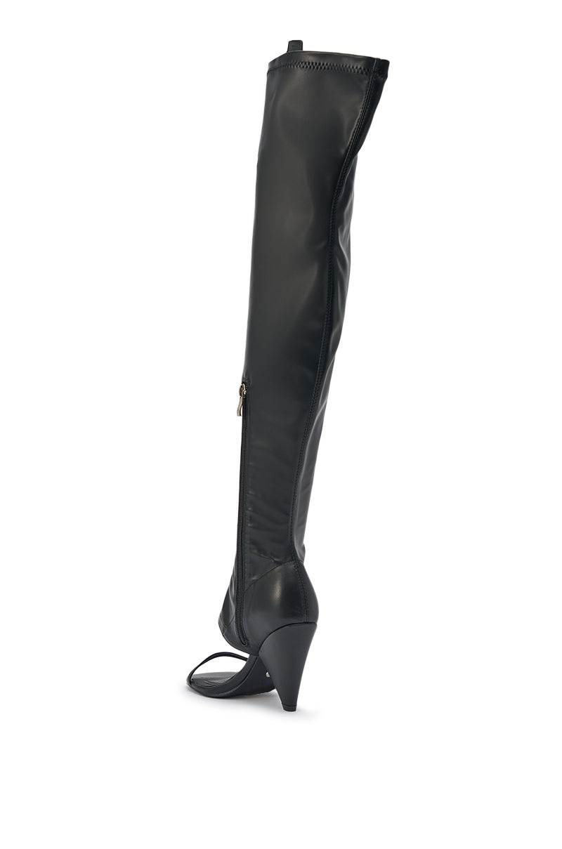 The AZALEA WANG RAGNAR Black Chunky Stretch PU Over the Knee Boot features a pointed toe, side zipper, and open heel and toe design, shown in black against a white background. 6