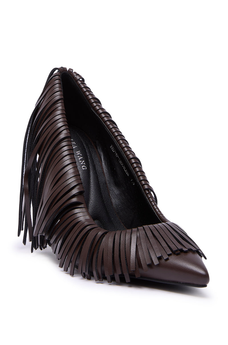 The AZALEA WANG RALPH CHOCOLATE FRINGE CLASSIC PUMP features a pointed toe, stiletto heel, and decorative faux leather fringe detailing along the front.