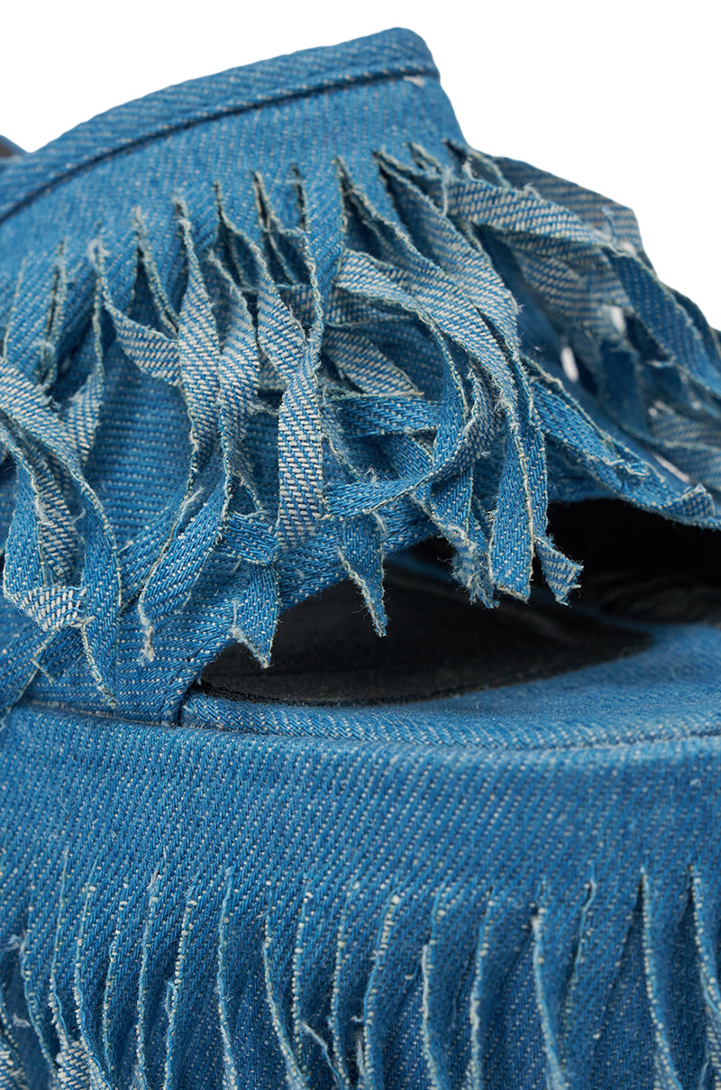 Close-up of the AKIRA GOLD RAMESHA DENIM FRINGE PLATFORM SANDAL in blue, featuring frayed fringe edges, visible stitching, and textured denim fabric for a bold statement look. 6