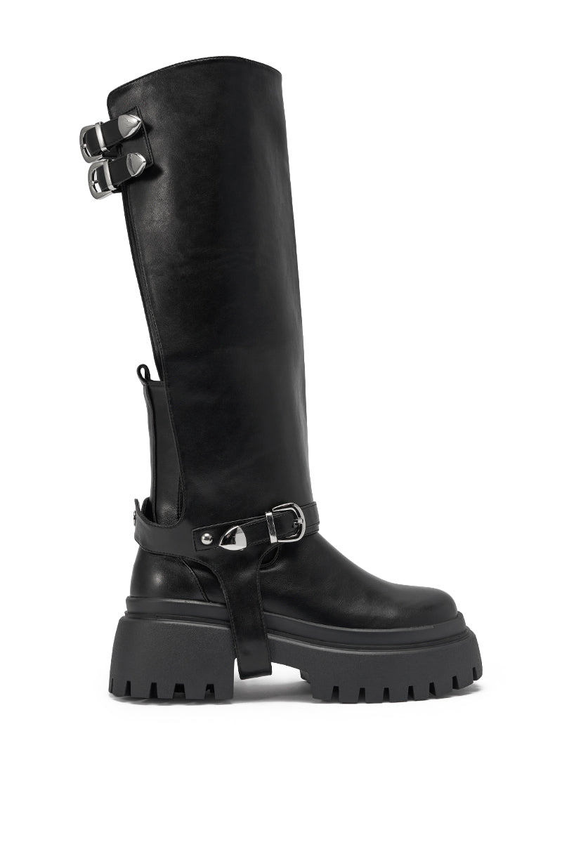 The AZALEA WANG RAMPAGE BLACK DISTRESSED TWO PIECE COMBAT BOOT features a knee-high black faux leather shaft, chunky platform lug sole, two silver buckles on the upper shaft, and an ankle strap with a silver buckle and heart detail. 5