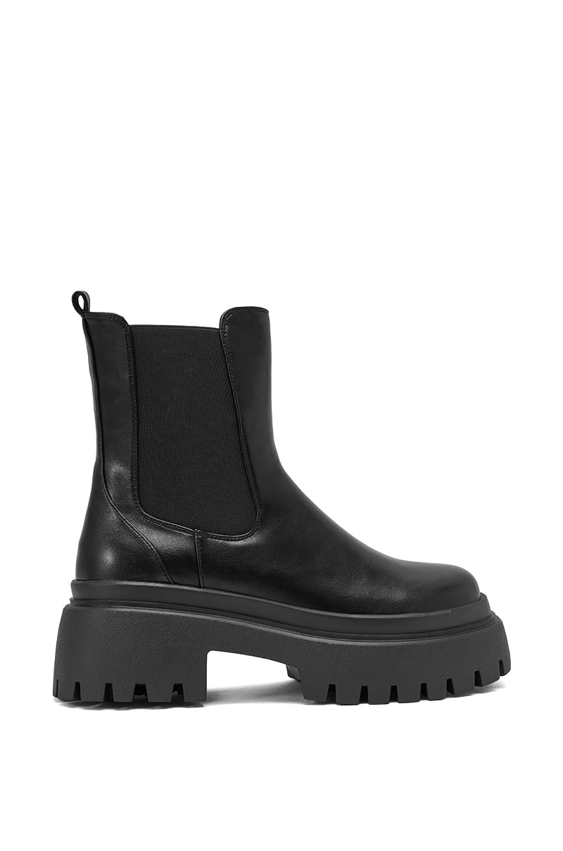 The AZALEA WANG RAMPAGE BLACK DISTRESSED TWO PIECE COMBAT BOOT is a black faux leather combat boot with a chunky platform lug sole, elastic side panels, and back pull tab, shown in side profile on a white background. 6