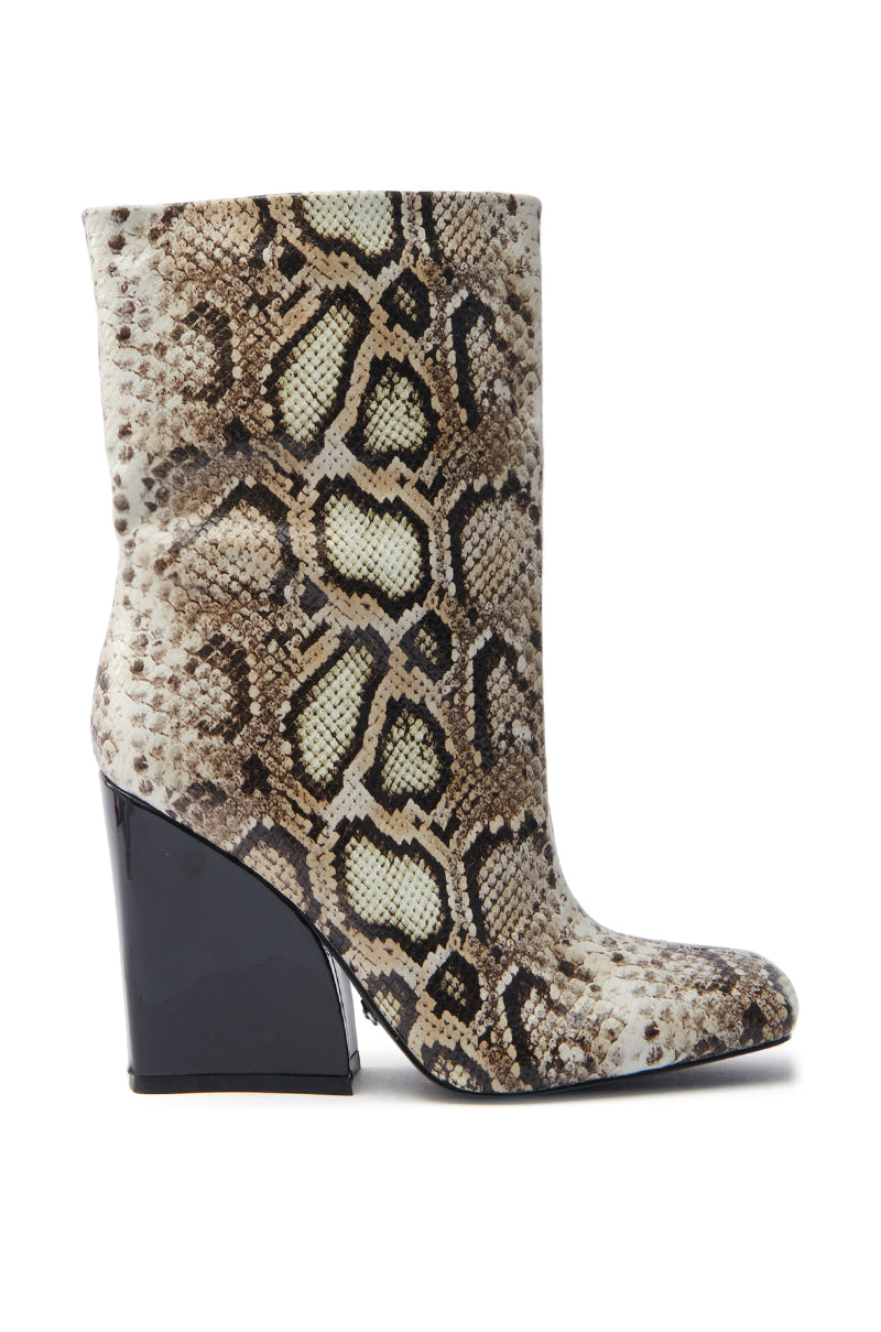 The AZALEA WANG RANSOM BLACK MULTI SNAKE BOOTIE is a stylish ankle bootie made from vegan leather with shades of brown, beige, and black snake print and features a shiny black chunky heel for a bold, sophisticated look.