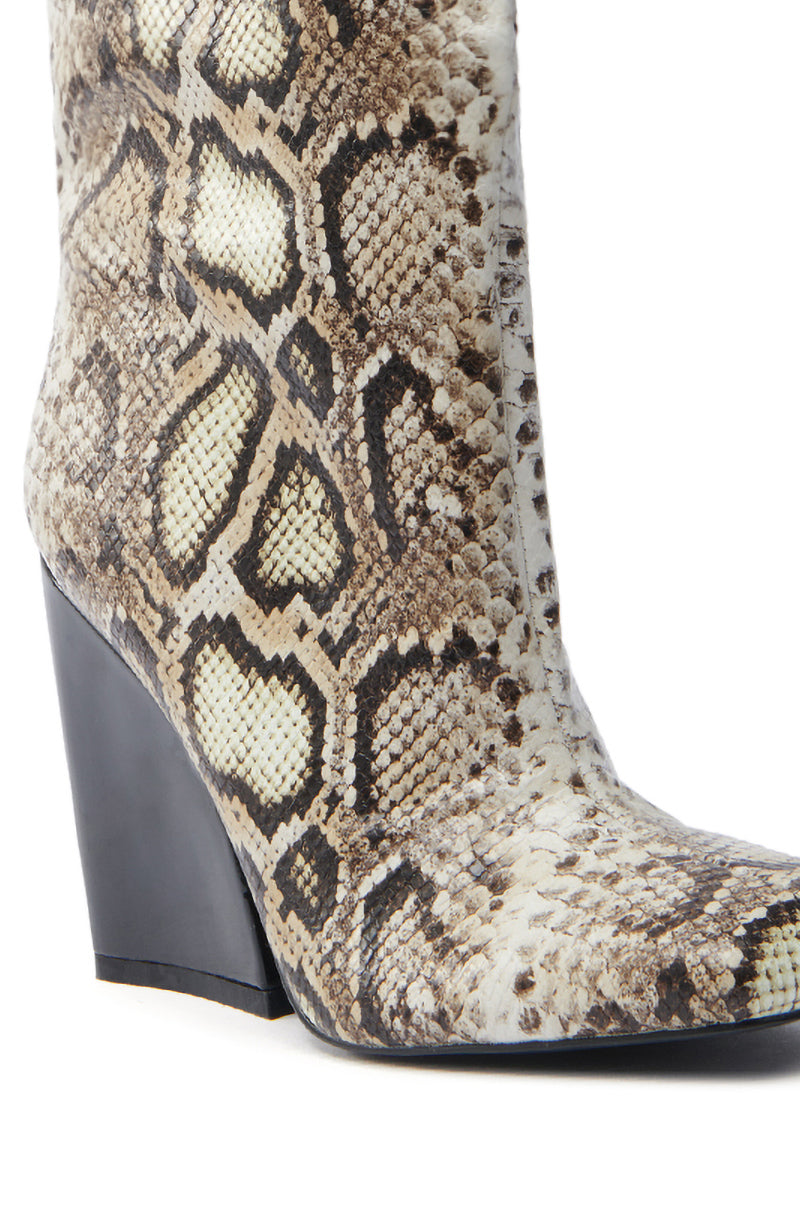 The AZALEA WANG RANSOM BLACK MULTI SNAKE BOOTIE features a detailed snakeskin design in brown and cream shades, crafted from vegan leather with a modern high, chunky black wedge heel.