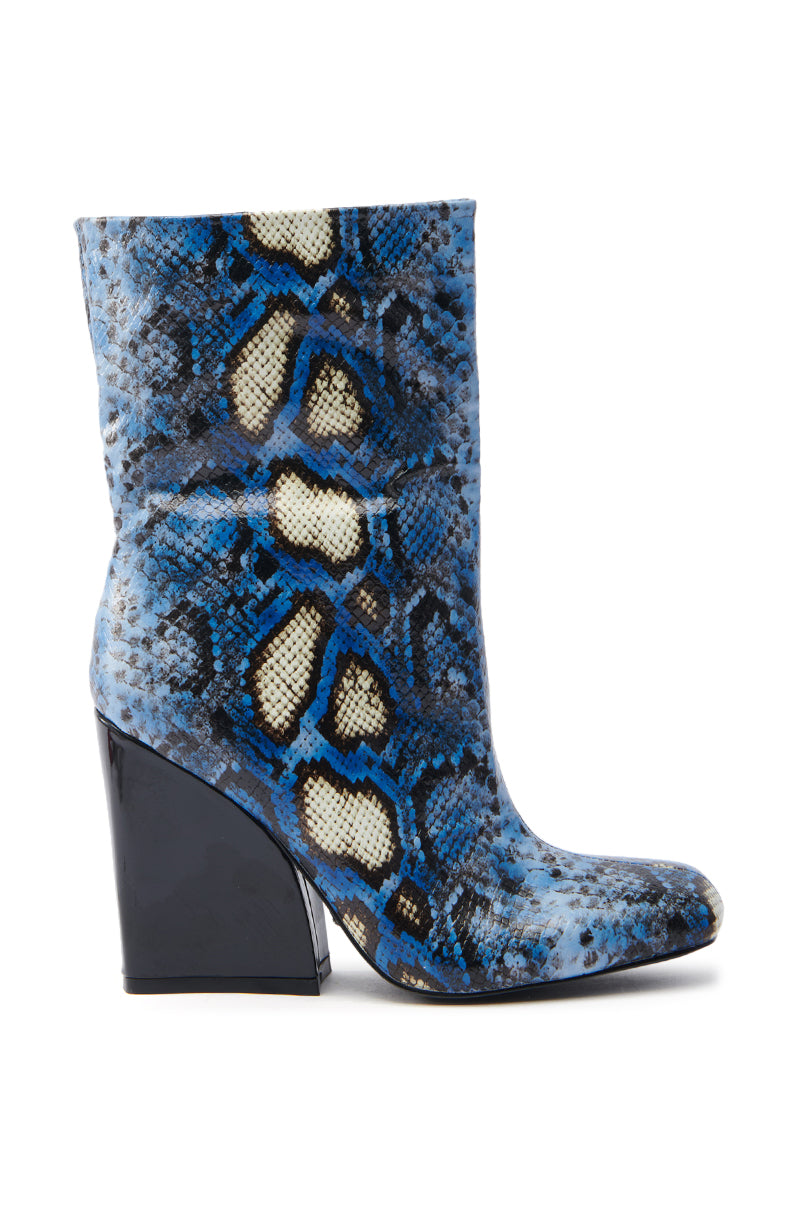 Explore the AZALEA WANG RANSOM BLUE MULTI SNAKE BOOTIE, an ankle-high boot crafted from vegan leather in a vibrant blue and black snakeskin pattern, featuring a chunky black heel and round toe for a trendy look with bold reptile texture.