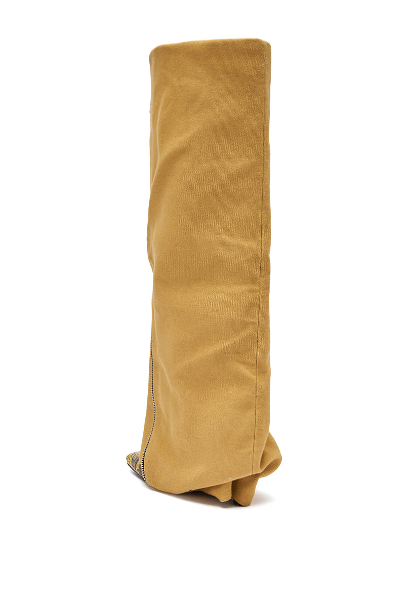 The AKIRA GOLD RASHAWN KHAKI AND SNAKE BOOT is a tall, slouchy tan over-the-knee boot with a pointy toe and minimal detailing, displayed against a plain white background. 5