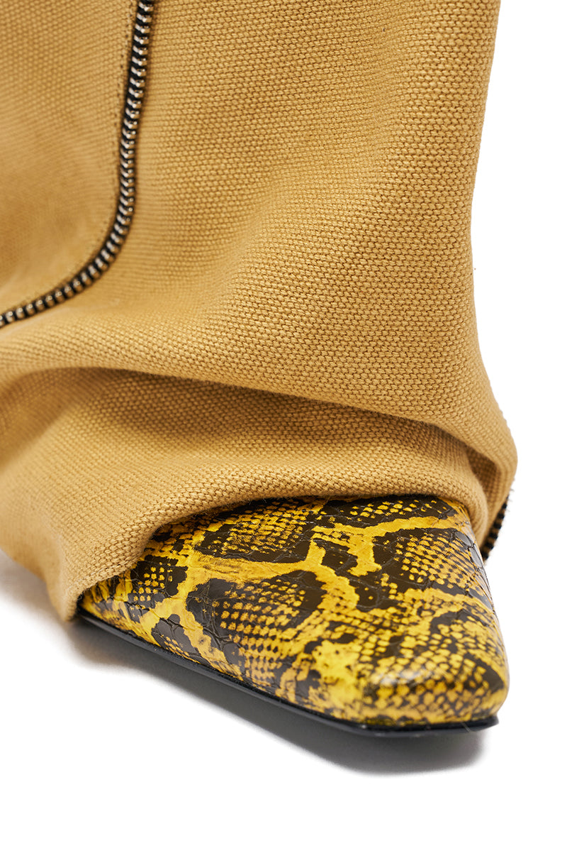 Close-up of the AKIRA GOLD RASHAWN KHAKI AND SNAKE BOOT, featuring a tan fabric upper, pointed toe, and striking yellow and black snakeskin pattern with a silver zipper accent for a bold, modern look. 6