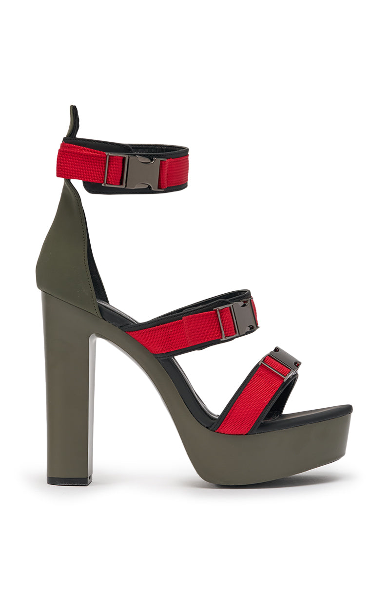 The AZALEA WANG RAYLYN RED PLATFORM CHUNKY SANDAL features a high heel, olive green sole, comfort cushion insole, and faux leather with three red straps and black buckle fastenings at the toe, instep, and ankle. 3