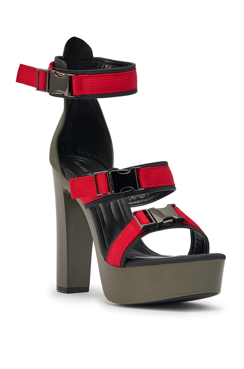 The AZALEA WANG RAYLYN RED PLATFORM CHUNKY SANDAL features a faux leather upper, olive green platform sole, black footbed, and three black-and-red buckle straps (ankle and foot). Comfort cushion insole ensures all-day wear. 4