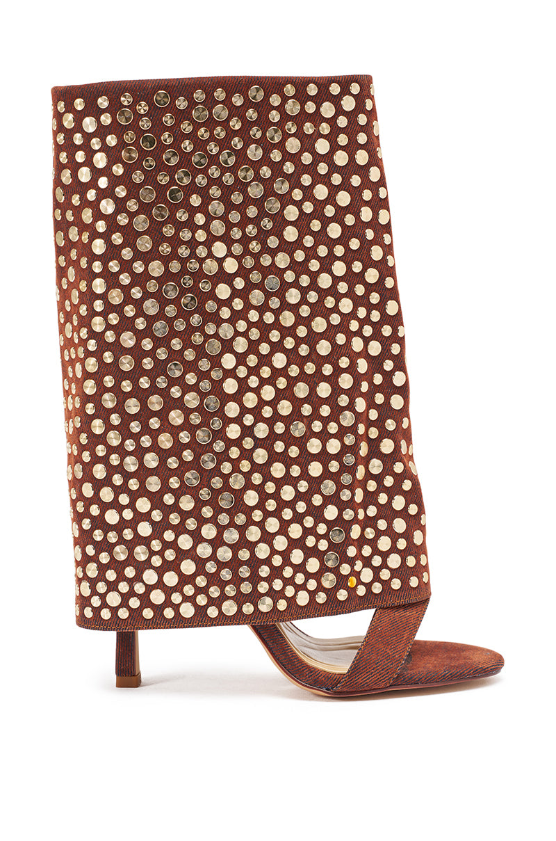 The AKIRA GOLD RAYSSA BURNT ORANGE GOLD HARDWARE EMBELLISHED STILETTO SANDAL is a bold open-toe faux suede heel with a wide, slouchy ankle cuff adorned in gold stud accents arranged in a dotted pattern. 3