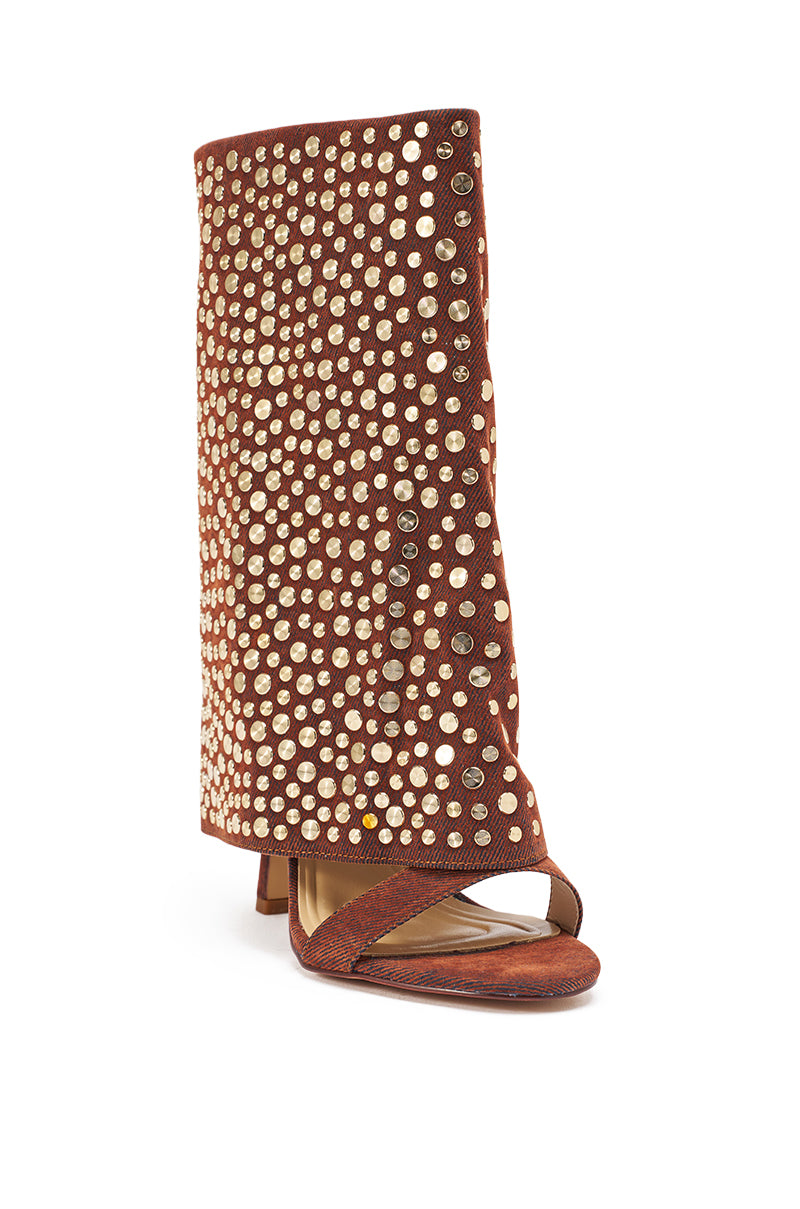 The AKIRA GOLD RAYSSA BURNT ORANGE GOLD HARDWARE EMBELLISHED STILETTO SANDAL features a high stiletto heel, open toe, slouchy burnt orange faux suede upper, gold hardware embellishments, and an asymmetrical front strap. 4
