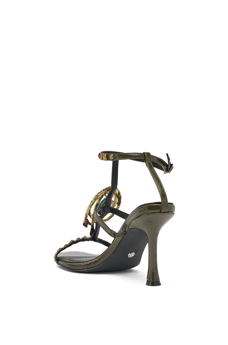 The AZALEA WANG REPUTATION OLIVE PU EMBELLISHED STILETTO SANDAL is a glossy green high heel with braided front strap, gold accents, and an adjustable buckle ankle strap, pictured from the rear against a white background. 5