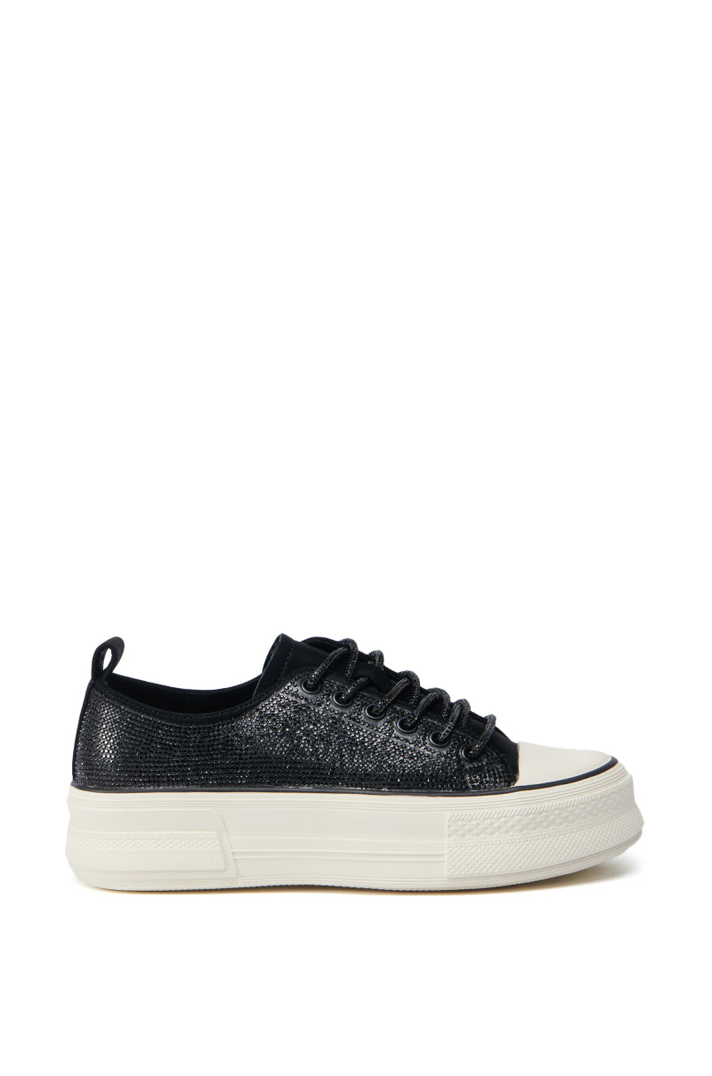The AZALEA WANG REVIVAL BLACK RHINESTONE FLATFORM SNEAKER, showcasing a black rhinestone design and faux leather upper with white thick flatform soles and black laces, is elegantly displayed from the side against a pristine white background.