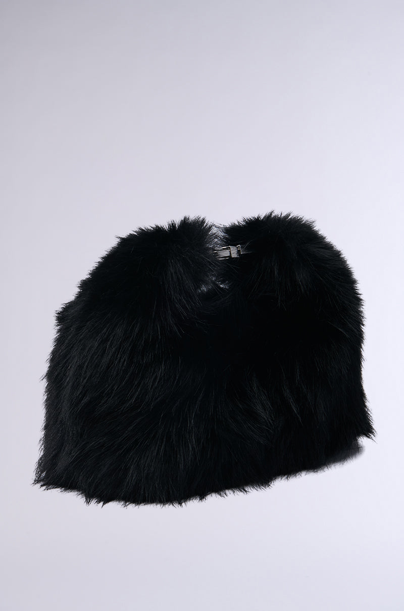 A fluffy black faux fur shawl paired effortlessly with the "IM THE ONE" mini fur purse, all set against a plain light gray background. 2