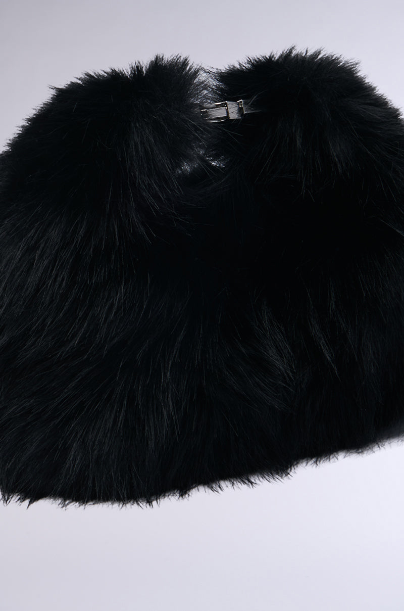 A plush black faux fur shawl is displayed against a light gray background, stylishly complemented by the IM THE ONE MINI FUR PURSE in matching faux fur. The shawl is adorned with a metallic clasp for fastening, enhancing its sophisticated appearance. 3
