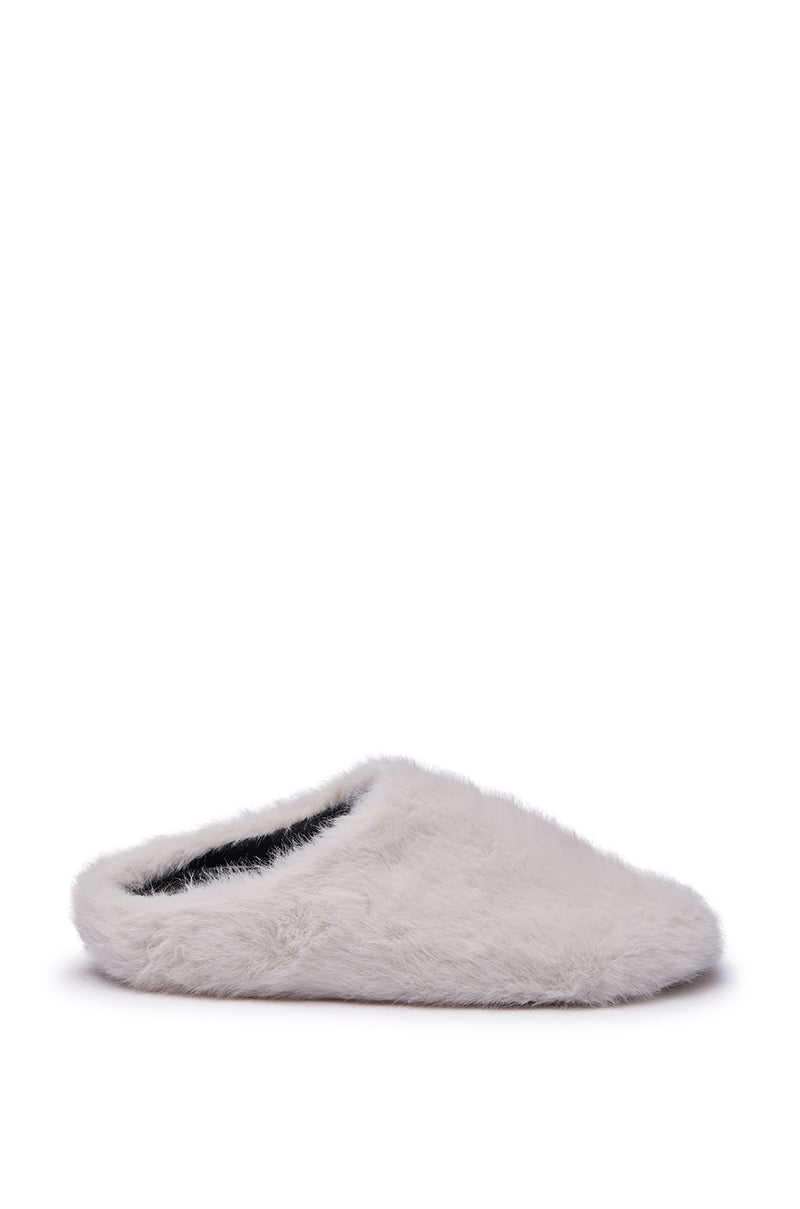 The AKIRA RHYS Ivory Fuzzy Flat, a single white slipper with an almond-shaped, closed toe, is displayed against a plain white background.