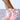 A person wearing AZALEA WANG RIORDAN PINK FUR HIGHTOP SNEAKERS, featuring vibrant pink faux fur and white laces, perfectly pairs these stylish sneakers with knee-length frayed denim shorts against a plain background.