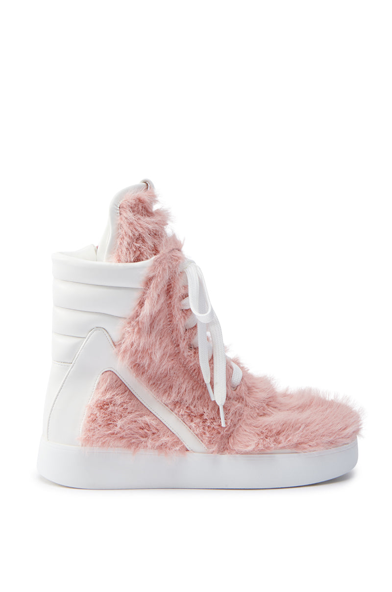 The AZALEA WANG RIORDAN PINK FUR HIGHTOP SNEAKER boasts a plush pink faux fur exterior with sleek white leather accents, complemented by a white sole and laces, creating a unique and stylish look.