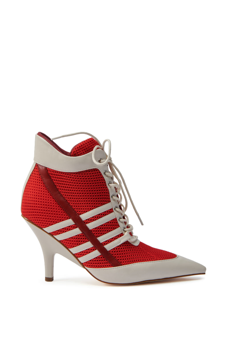The AZALEA WANG ROBERT RED SPORTY SNEAKER LOOK BOOTIE is a red mesh lace-up ankle boot with a pointed toe, white accents, sporty diagonal stripes, and a mid-height heel for an athletic-chic style. 3