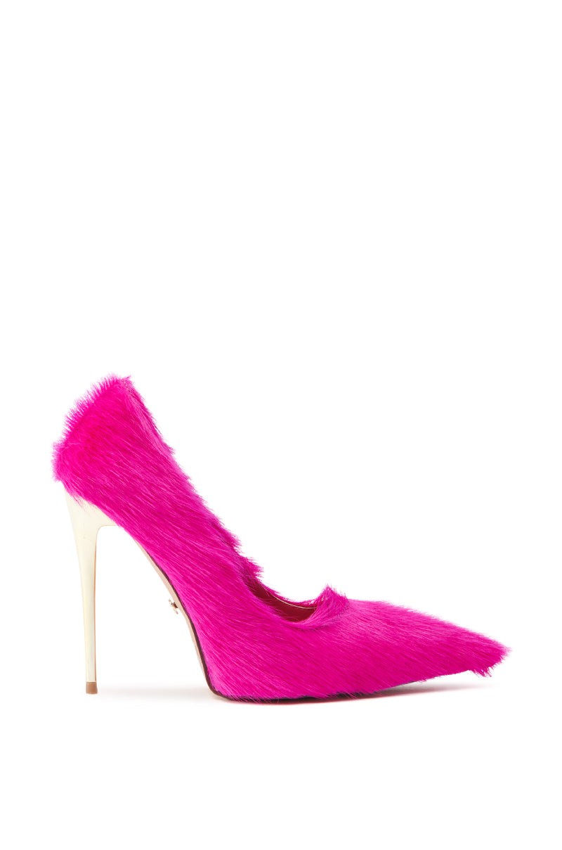 The AZALEA WANG ROMEE FUCHSIA PONY HAIR PUMP showcases a pointed toe and slim, light stiletto heel. Displayed in side profile against a white background, the vibrant design and furry texture stand out.