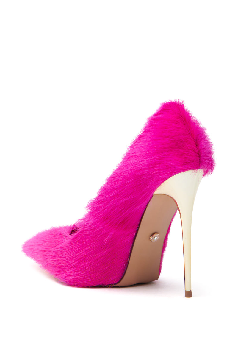 The AZALEA WANG ROMEE FUCHSIA PONY HAIR PUMP exudes boldness with its bright pink faux fur and vibrant hue, featuring a pointed toe and contrasting sleek white stiletto heel for an eye-catching statement.