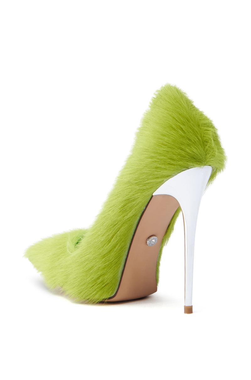The AZALEA WANG ROMEE GREEN PONY HAIR PUMP features vibrant green faux pony hair and a sleek white stiletto heel. A light brown sole with an embedded jewel adds charm, while its metallic silver hint shines against a plain white background.