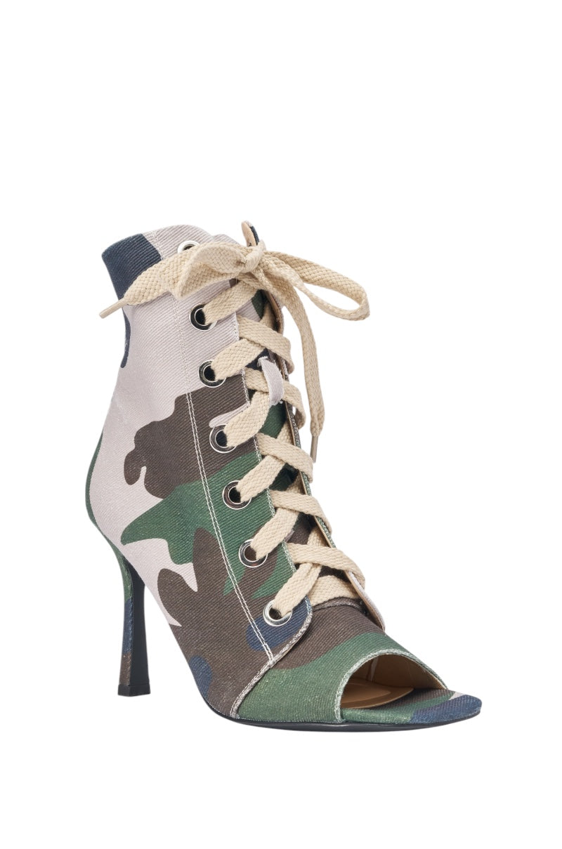 The AZALEA WANG ROOFTOP CAMO OPEN TOE LACE UP BOOTIE is a high-heeled, camo canvas bootie with a green, brown, and beige camouflage pattern, open toe, lace-up front with beige laces, and metallic eyelets. 4