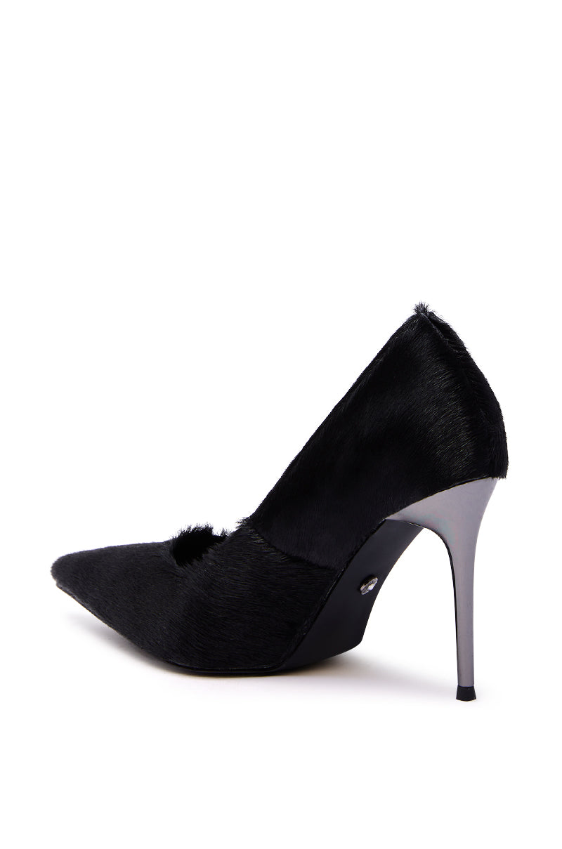 The AZALEA WANG ROSEE BLACK PONY HAIR PUMP features a textured, fur-like black upper, pointed toe, and metallic silver stiletto heel. The elegant shoe is shown against a plain white background.