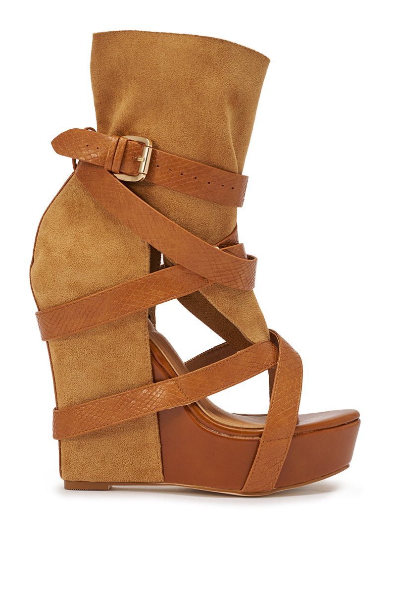 The AZALEA WANG ROTHKO WEDGE SANDAL IN CAMEL features a brown suede and leather look, a high wedge heel, platform sole, wide ankle cuff with buckle, and multiple crisscross straps for a chic finish. 4