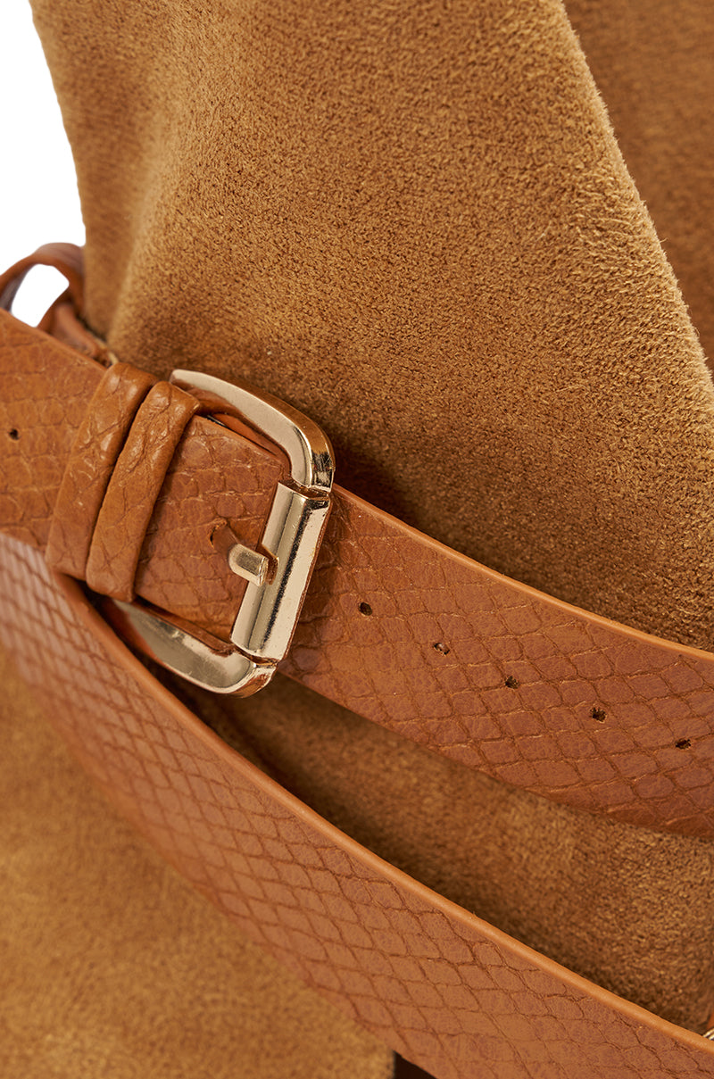 Close-up of the AZALEA WANG ROTHKO WEDGE SANDAL IN CAMEL, showcasing a textured light brown strap with a gold buckle and subtle diamond pattern, adding detail reminiscent of crocodile-embossed platform sandals. 7