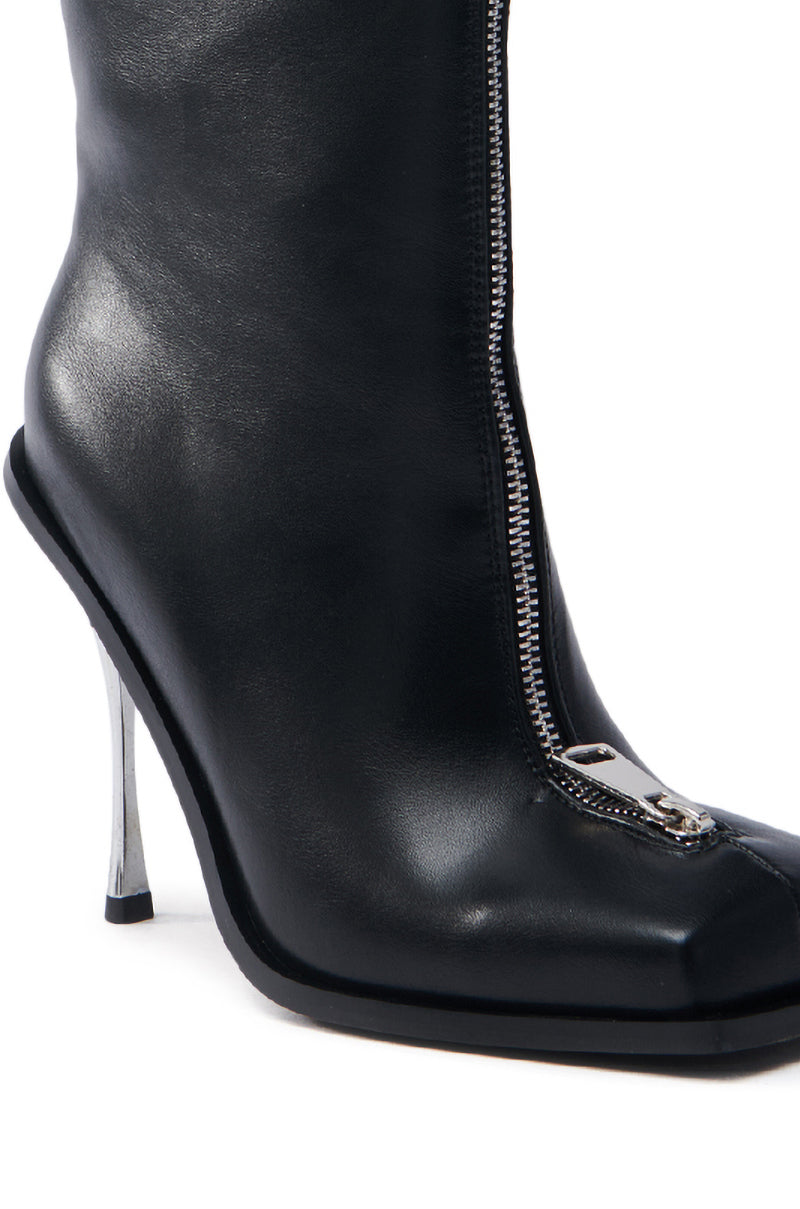 The AZALEA WANG ROUSSE FRONT ZIP BOOT IN BLACK features a faux leather high-heeled design with a shiny silver stiletto heel and front zipper detail, showcased on a plain white background.