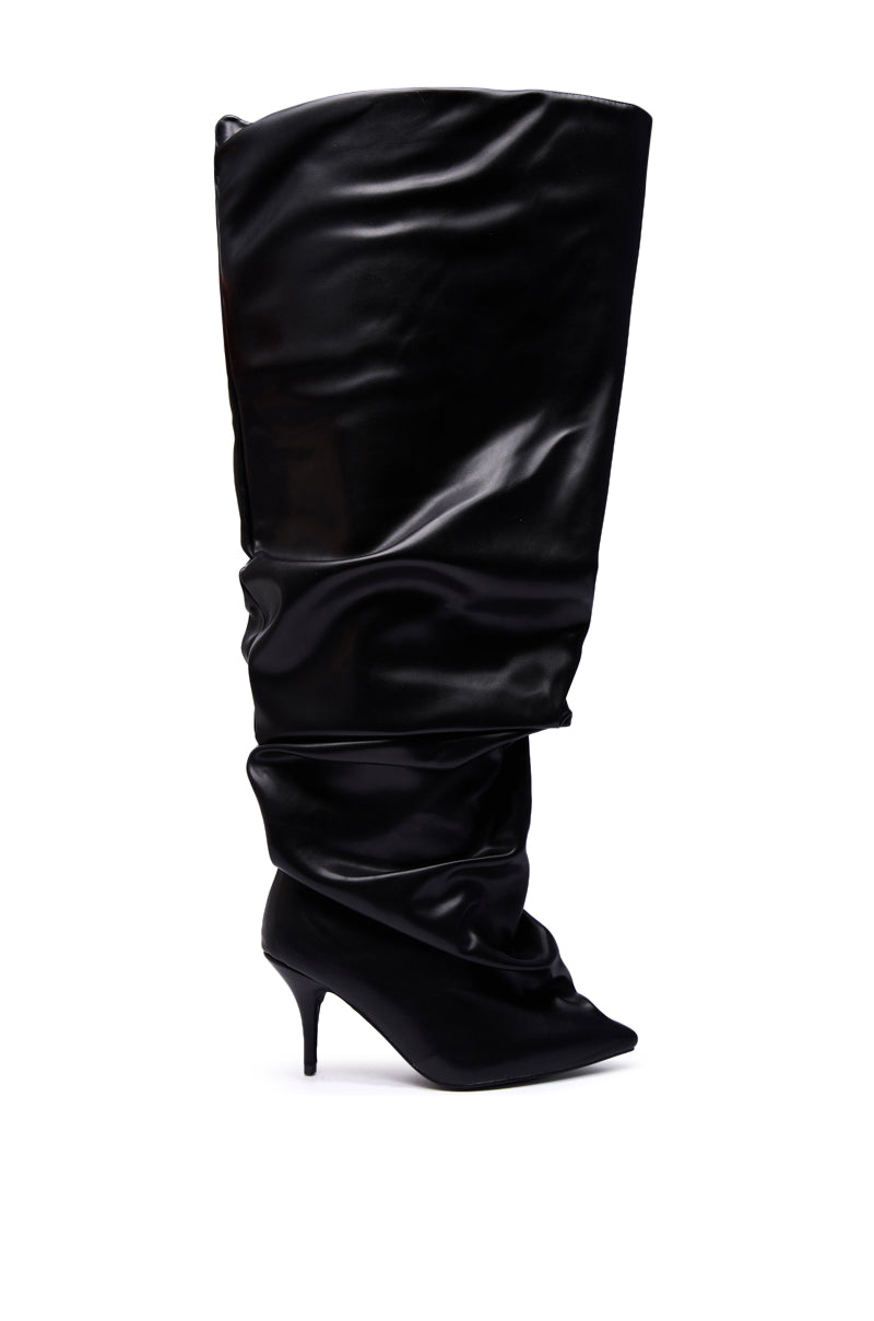 The AZALEA WANG RUBIUS BLACK EXTREME RUCHED BOOT is a tall, slouchy black stiletto with a pointed toe and shiny finish, displayed against a white background.