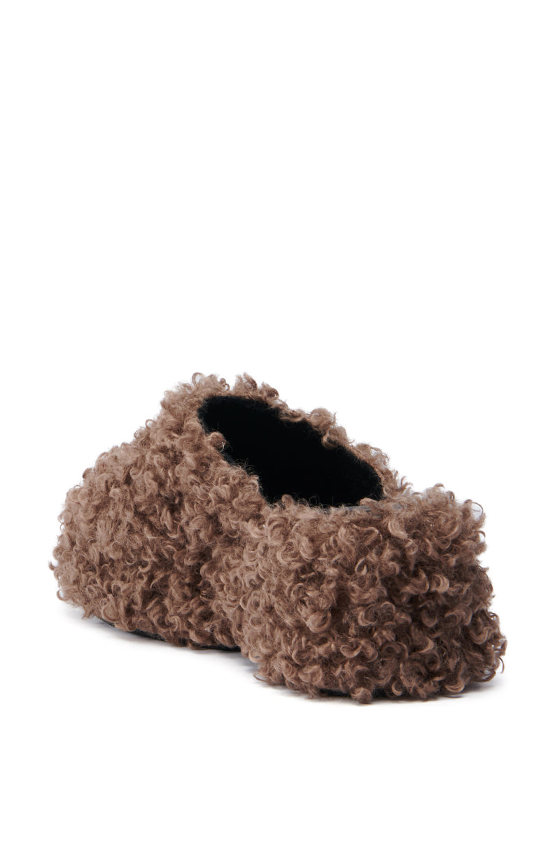The AZALEA WANG RUPERBT BROWN CURLY MULE, showcasing a plush faux fur upper and a stylish flatform sole, is presented from a side angle and slightly above against a plain white backdrop. 4