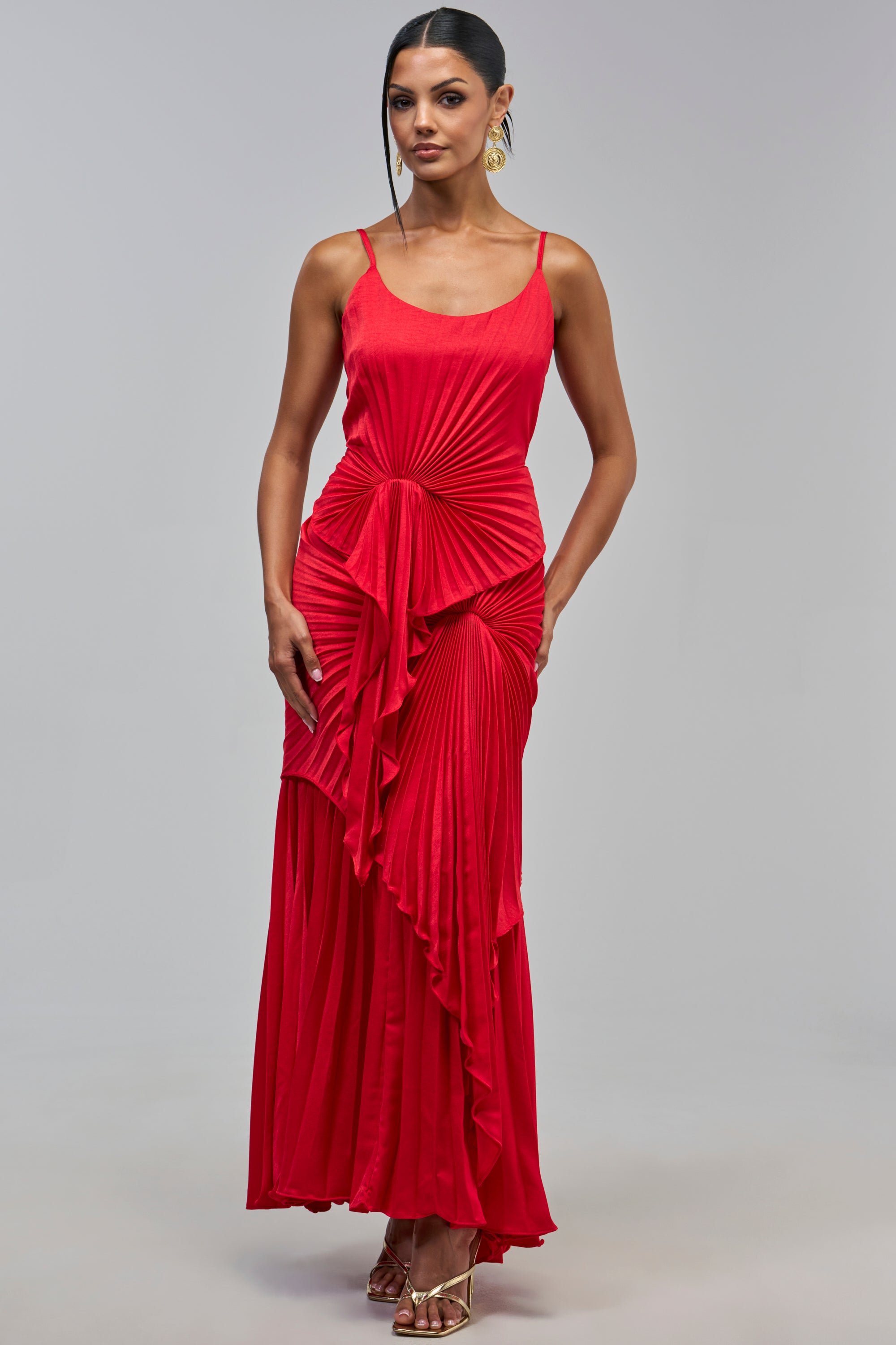 WEEKEND EDIT RUFFLE MAXI DRESS in red, featuring a sleeveless pleated design, a formal bodice, a front ruffle detail, and spaghetti straps.