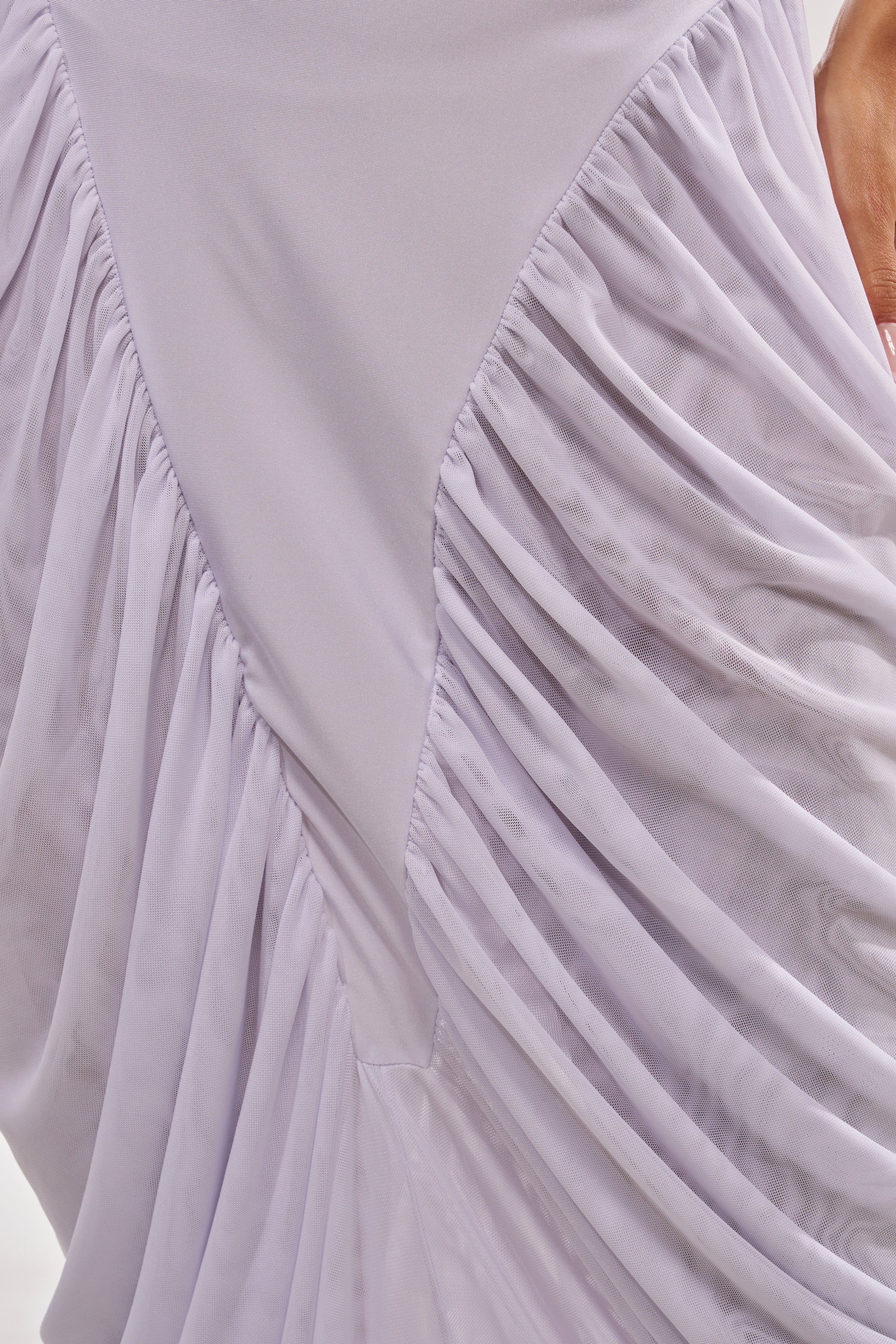 Close-up of the DREAMY RUCHED SKIRT IN WHITE, showcasing gathered, pleated fabric with a smooth central panel. A hand appears partially at the top right edge of the image. 8