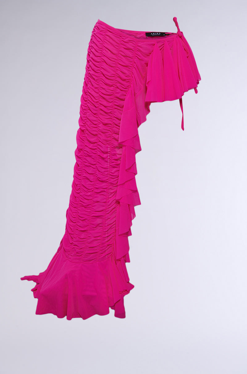 The LAYERED UP MESH RUFFLE BELT SKIRT features a vibrant pink mesh, ruched detailing, ruffled trim, and cascading layers—perfect for festival fashion—shown against a plain light background.