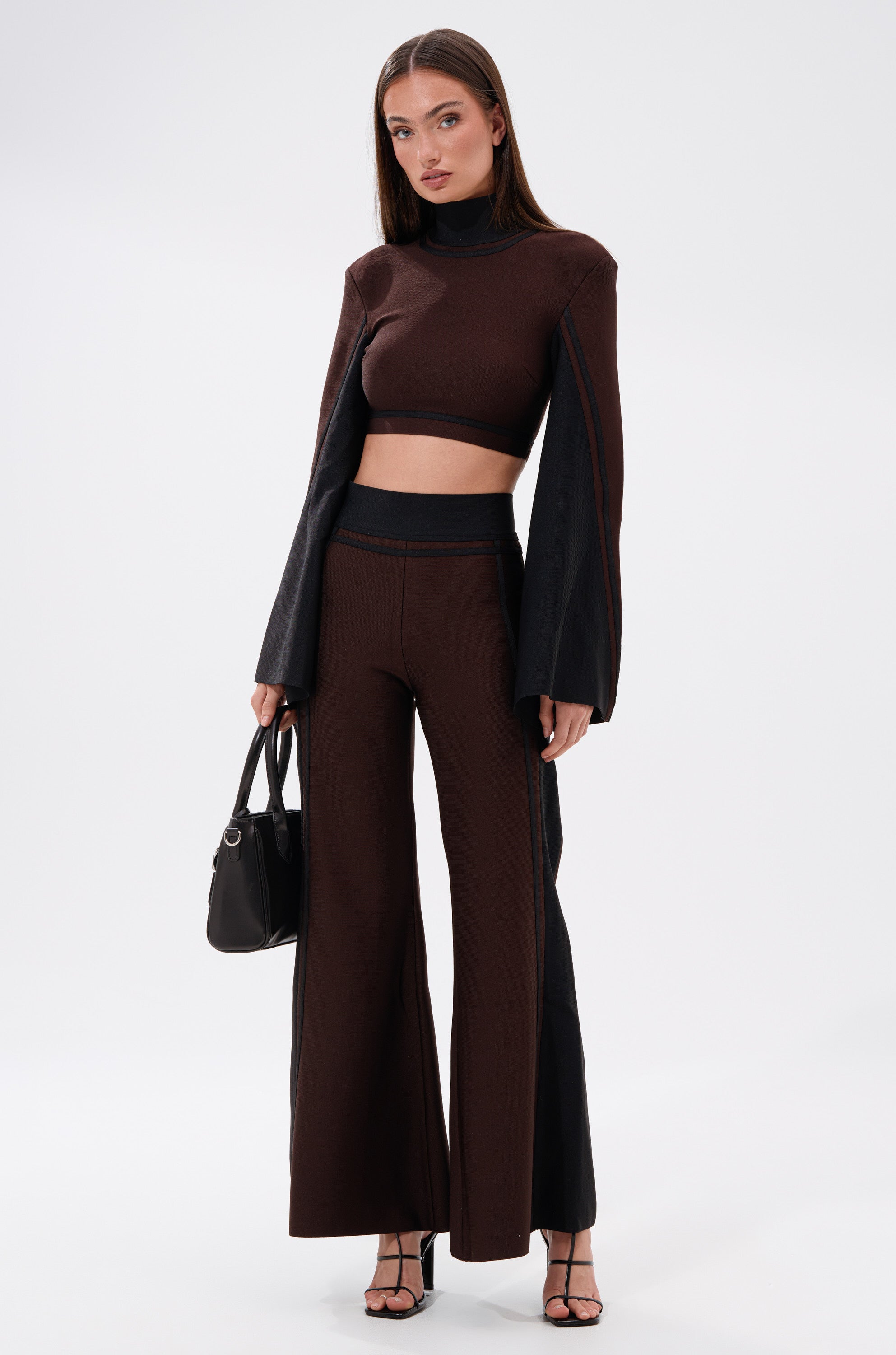 A woman wearing the MAZIE WIDE LEG PALAZZO PANT in brown.