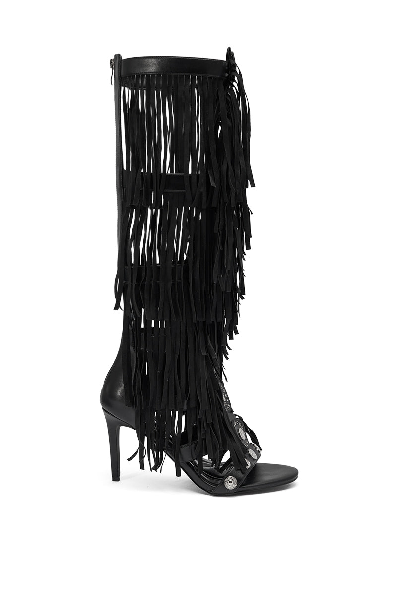 The AZALEA WANG SAMEYANA Black Fringe and Metal Stiletto Gladiator Sandal features a tall shaft, open toe, multiple layers of black suede fringe from ankle to top, and a sleek stiletto heel for bold style.