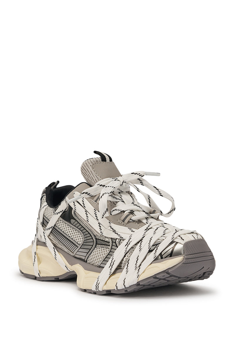 The AZALEA WANG SAMURAI GREY MULTI CHUNKY SNEAKER features a bold street-style design with a chunky platform sole, black and grey accents, and oversized white laces wrapped multiple times around the shoe. 4
