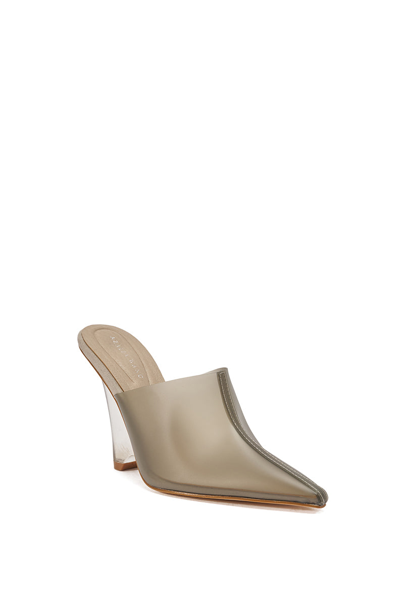 The AKIRA GOLD SANCTUS GREY PVC PUMP is a taupe, pointed-toe mule with a high transparent block heel and closed upper, featuring a modern minimalist design. It is shown against a white background.