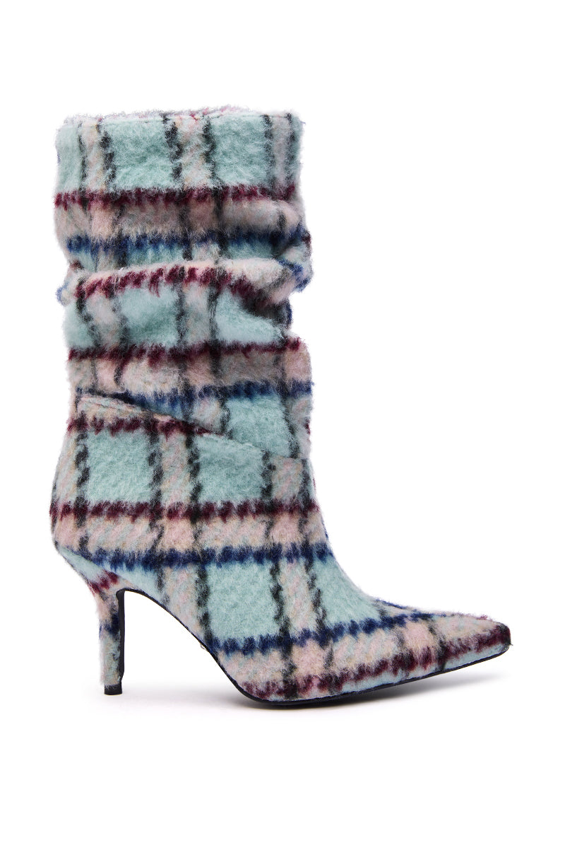 The AZALEA WANG SANJIV BLUE MULTI PLAID STILETO BOOTIE features a pointed toe, mid-heel, slouchy shaft, and fuzzy fabric in blue, pink, burgundy, and cream plaid.
